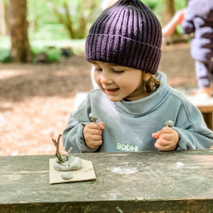 Boy playing with clay