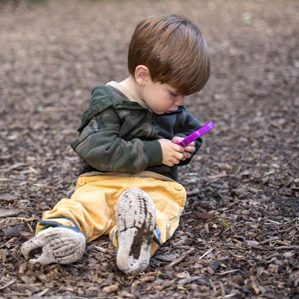 boy with magnifying glass